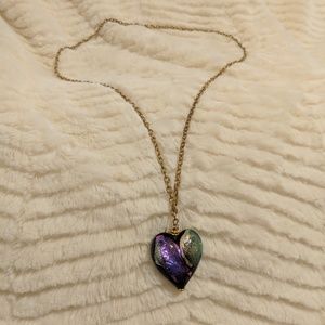 Murano glass heart pendant on gold chain.